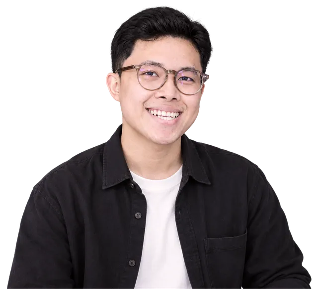 Dinh Huy Nguyen, smiling, in glasses and a black overshirt