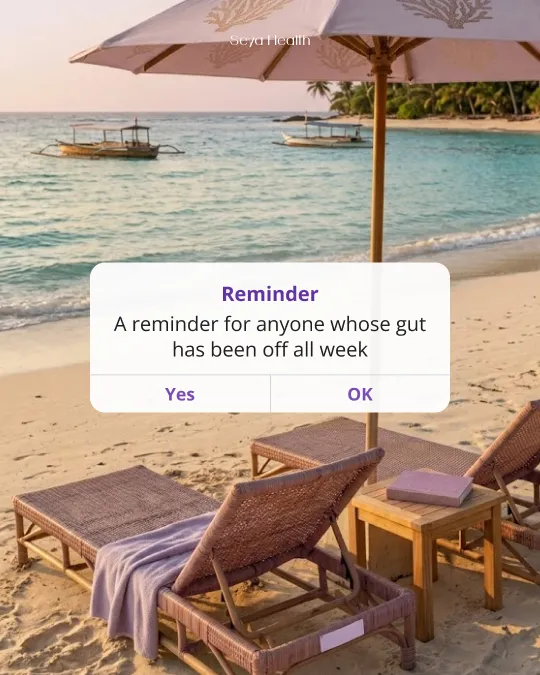 A phone reminder for anyone whose gut has been off all week, over a beach scene